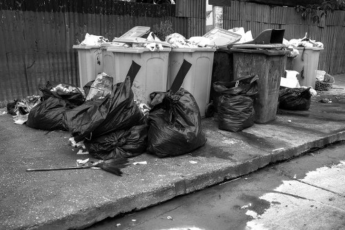 Construction site with builders waste being cleared in Uxbridge